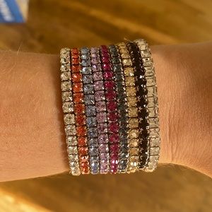 Stack of Swarovski slake bracelets
